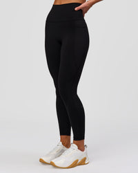 Woman wearing Fusion O.G Ultra High-Rise 7/8 Legging Pockets - Black | Model:Issy| Size:XS | Thumbnail Index: 3