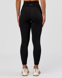 Woman wearing Fusion O.G Ultra High-Rise 7/8 Legging Pockets - Black | Model:Xs | Size:ISSY | Thumbnail Index: 5
