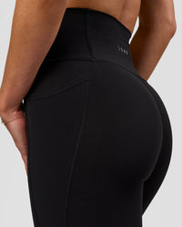 Woman wearing Fusion O.G Ultra High-Rise 7/8 Legging Pockets - Black | Model:Xs | Size:ISSY | Thumbnail Index: 6