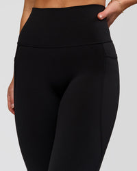 Woman wearing Fusion O.G Ultra High-Rise 7/8 Legging Pockets - Black | Model:Xs | Size:ISSY | Thumbnail Index: 7