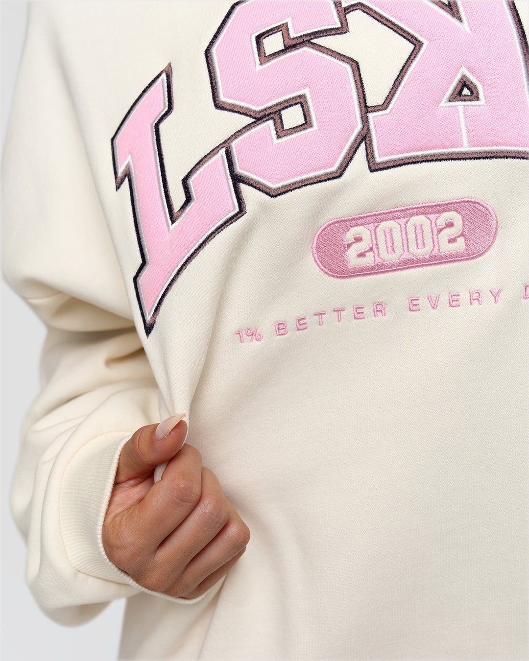 Woman wearing Varsity Boxy Crew - Off White-Pink Rose | Model:Bianca | Size:L