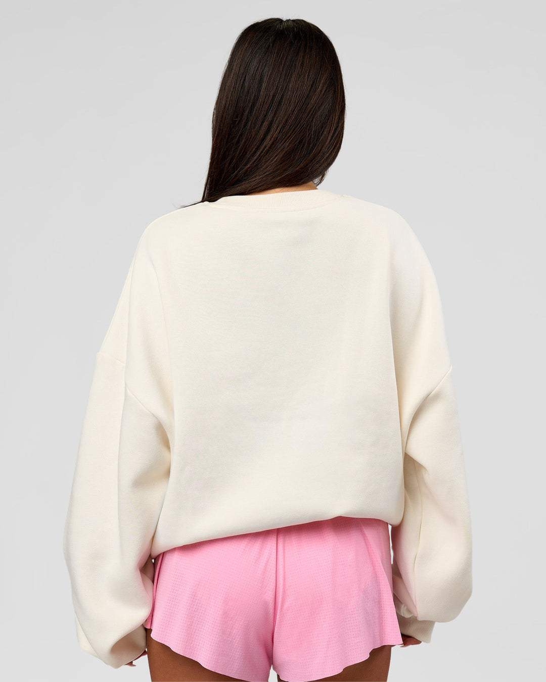 Woman wearing Varsity Boxy Crew - Off White-Pink Rose | Model:Bianca | Size:L