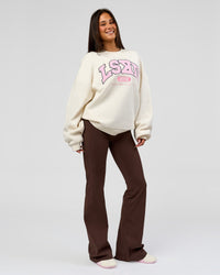 Woman wearing Varsity Boxy Crew - Off White-Pink Rose | Model:Bianca | Size:L