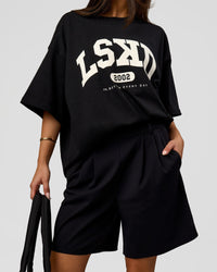 Woman wearing Varsity EST Heavyweight Oversized Tee  - Black-Off White | Model:Bianca | Size:L | Thumbnail Index: 12