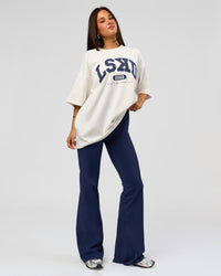 Woman wearing Varsity EST Heavyweight Oversized Tee  - Off White-Future Navy | Model:Bianca | Size:L