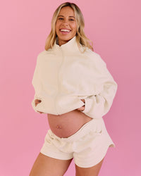 Woman wearing Bree Fleece Track Short - Vanilla Bean | Model:Bree | Size:L | Thumbnail Index: 6