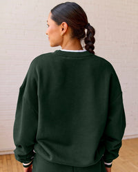 Woman wearing Go-To Dual Oversized Sweater - Midnight Green-White | Model:Meg | Size:M | Thumbnail Index: 3