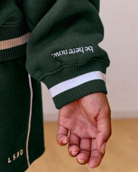 Woman wearing Go-To Dual Oversized Sweater - Midnight Green-White | Model:Meg | Size:M | Thumbnail Index: 4