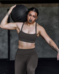 Woman wearing Momentum Sports Bra - Onyx | Model:Terai | Size:M | Thumbnail Index: 2