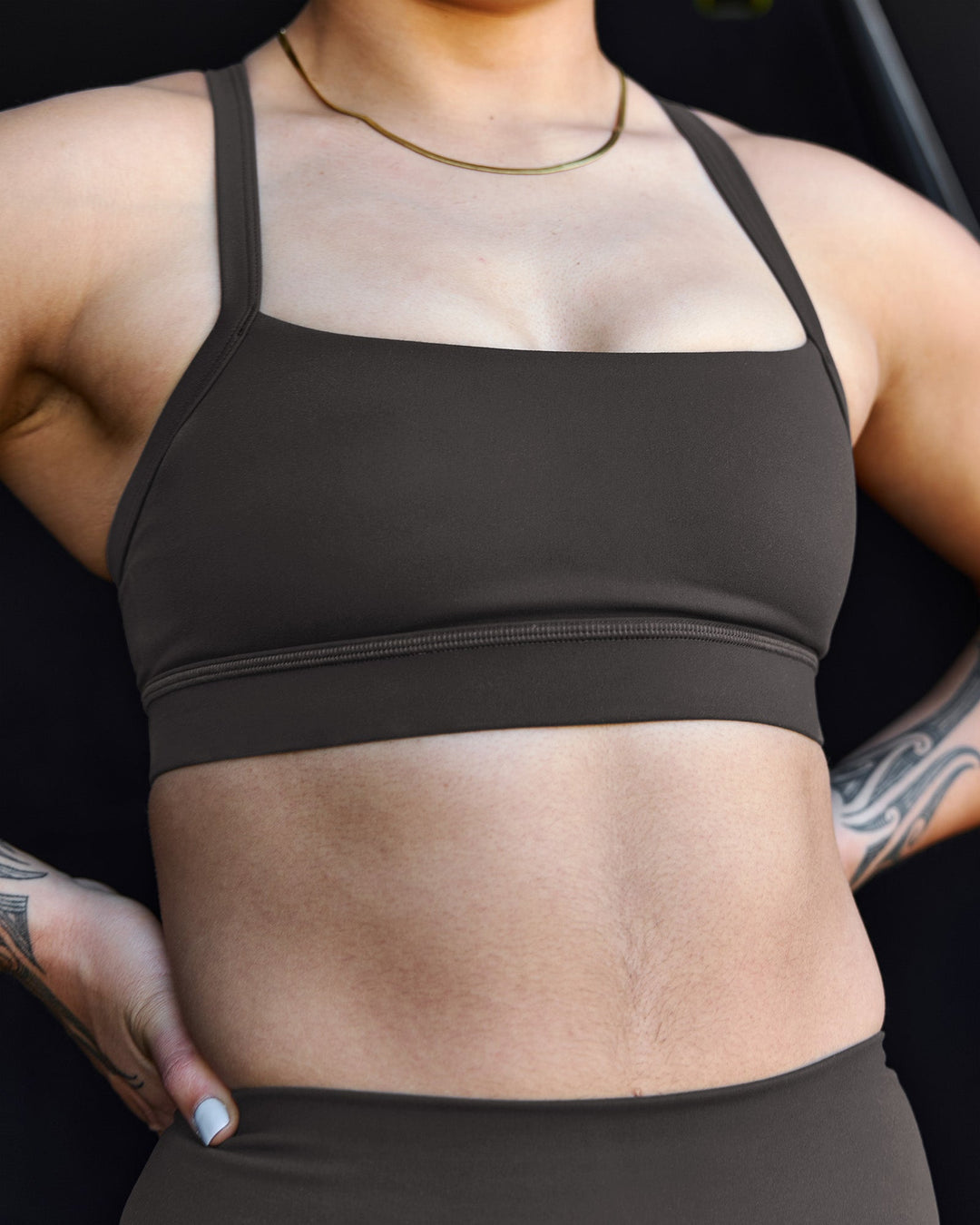 Woman wearing Momentum Sports Bra - Onyx | Model:Terai | Size:M - view 6