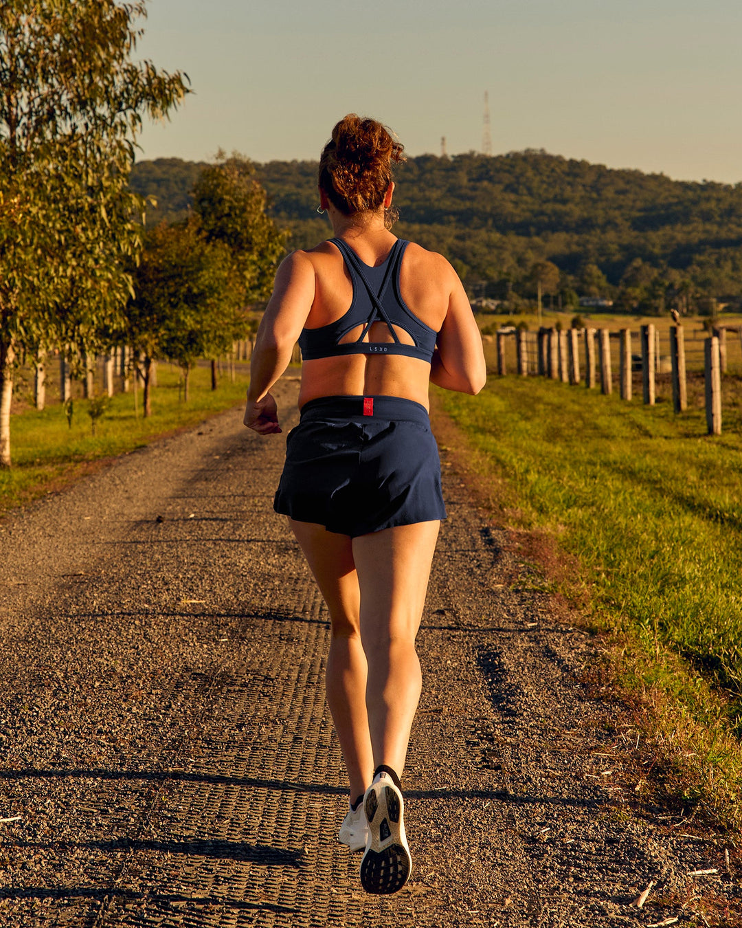Woman wearing Tia-Clair Toomey-Orr Accelerate 3" Storage Running Short - Future Navy | Model:Tia | Size:M - view 5