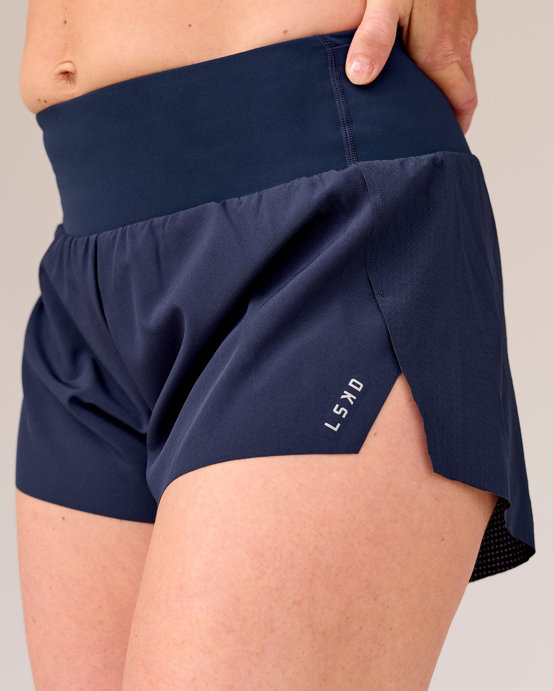 Woman wearing Tia-Clair Toomey-Orr Accelerate 3" Storage Running Short - Future Navy | Model:Tia | Size:M - view 6