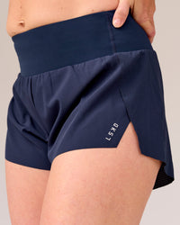 Woman wearing Tia-Clair Toomey-Orr Accelerate 3" Storage Running Short - Future Navy | Model:Tia | Size:M | Thumbnail Index: 5