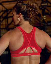 Woman wearing Unstoppable Racerback Sports Bra - Scarlet | Model:Tia | Size:M | Thumbnail Index: 6