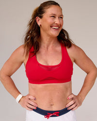 Woman wearing Unstoppable Racerback Sports Bra - Scarlet | Model:Tia | Size:M | Thumbnail Index: 5