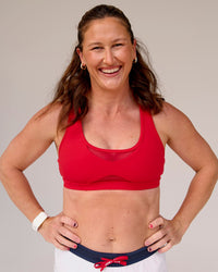 Woman wearing Unstoppable Racerback Sports Bra - Scarlet | Model:Tia | Size:M | Thumbnail Index: 2
