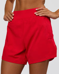 Woman wearing Challenger 5" Lined Performance Short - Scarlet | Model:Amity | Size:S
