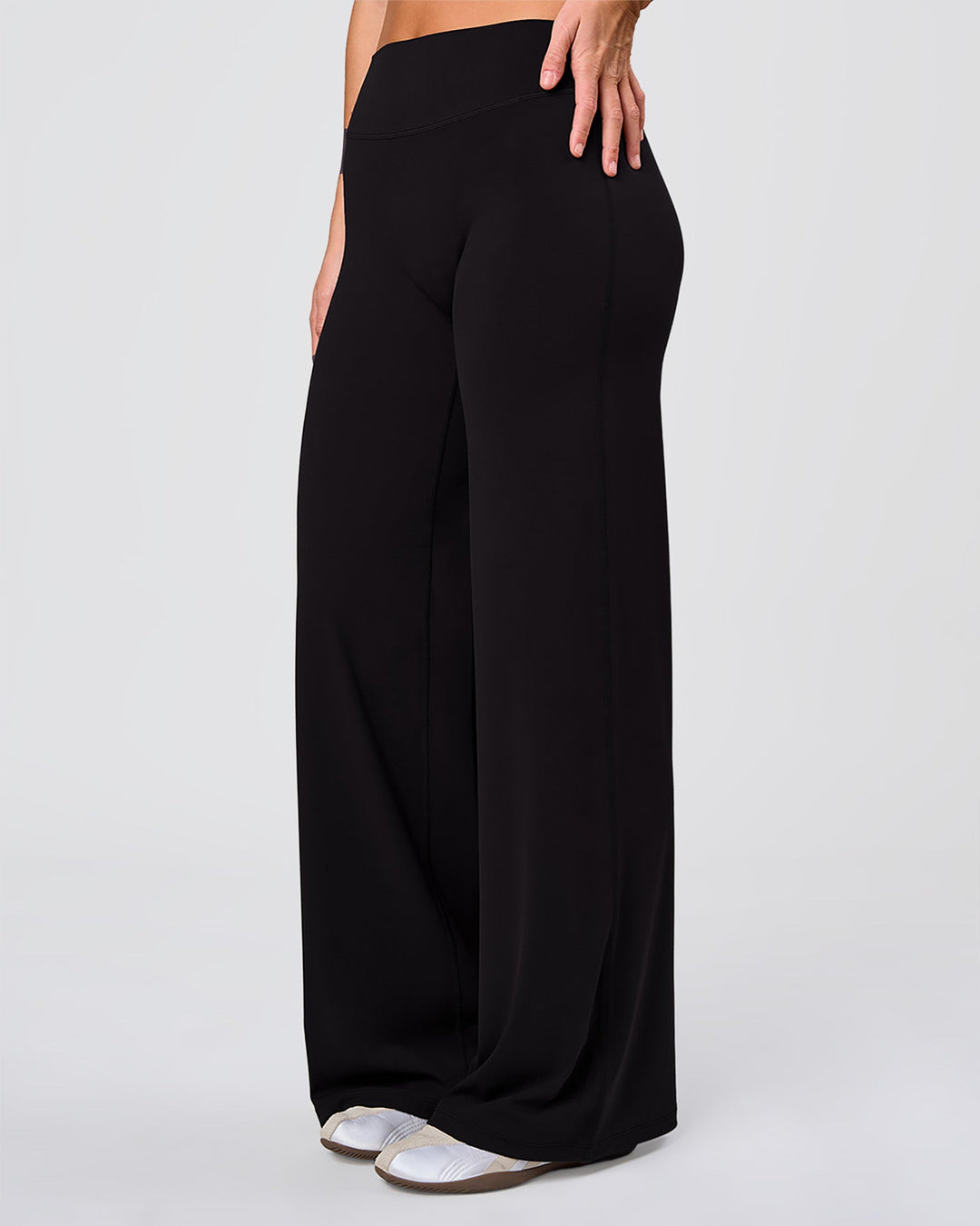 Woman wearing Elixir High-Rise Pant - Black | Model:Amity | Size:S - view 1