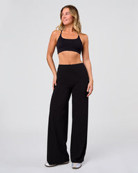 Woman wearing Elixir High-Rise Pant - Black | Model:Amity | Size:S | Thumbnail Index: 1