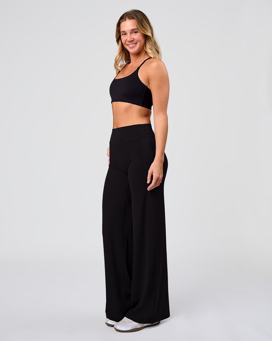Woman wearing Elixir High-Rise Pant - Black | Model:Amity | Size:S - view 6