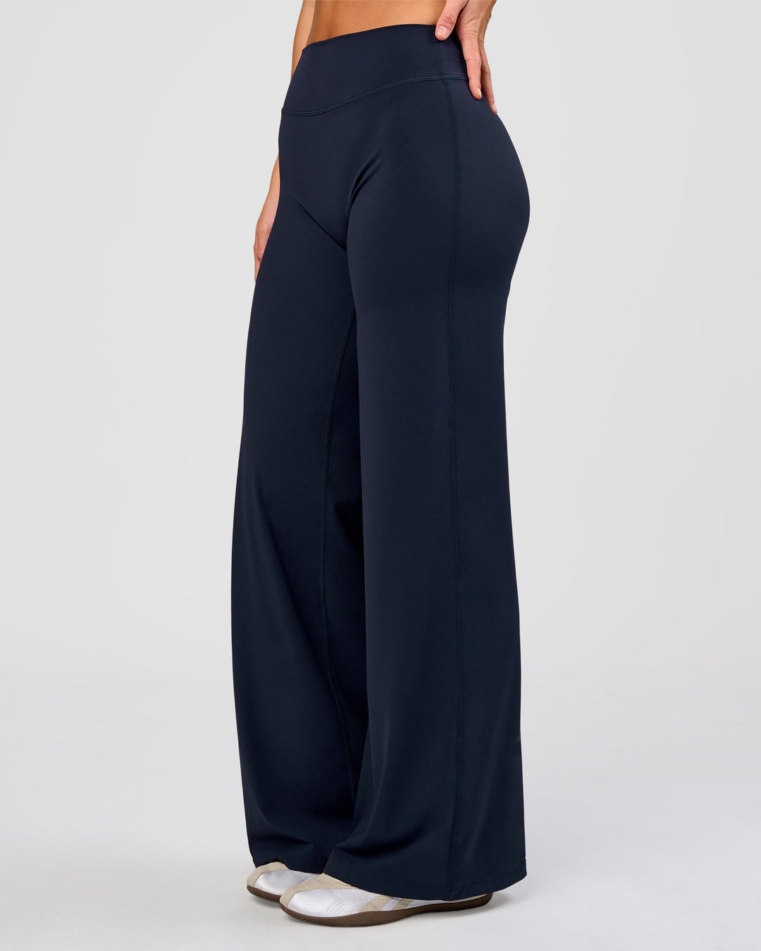 Woman wearing Elixir High-Rise Pant - Midnight Navy | Model:Amity | Size:S - view 1