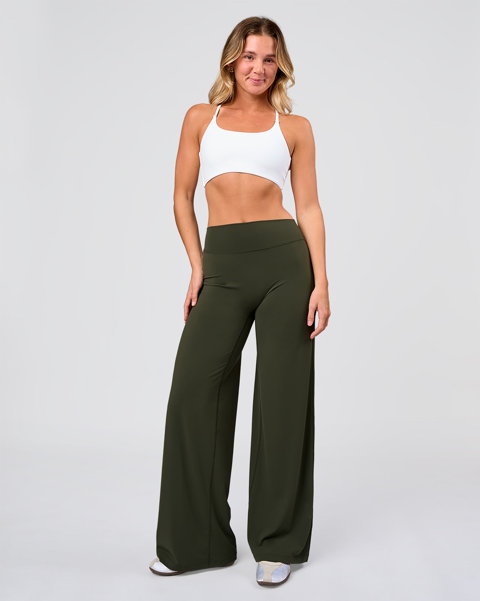 Woman wearing Elixir High-Rise Pant - Pure Olive | Model:Amity | Size:S