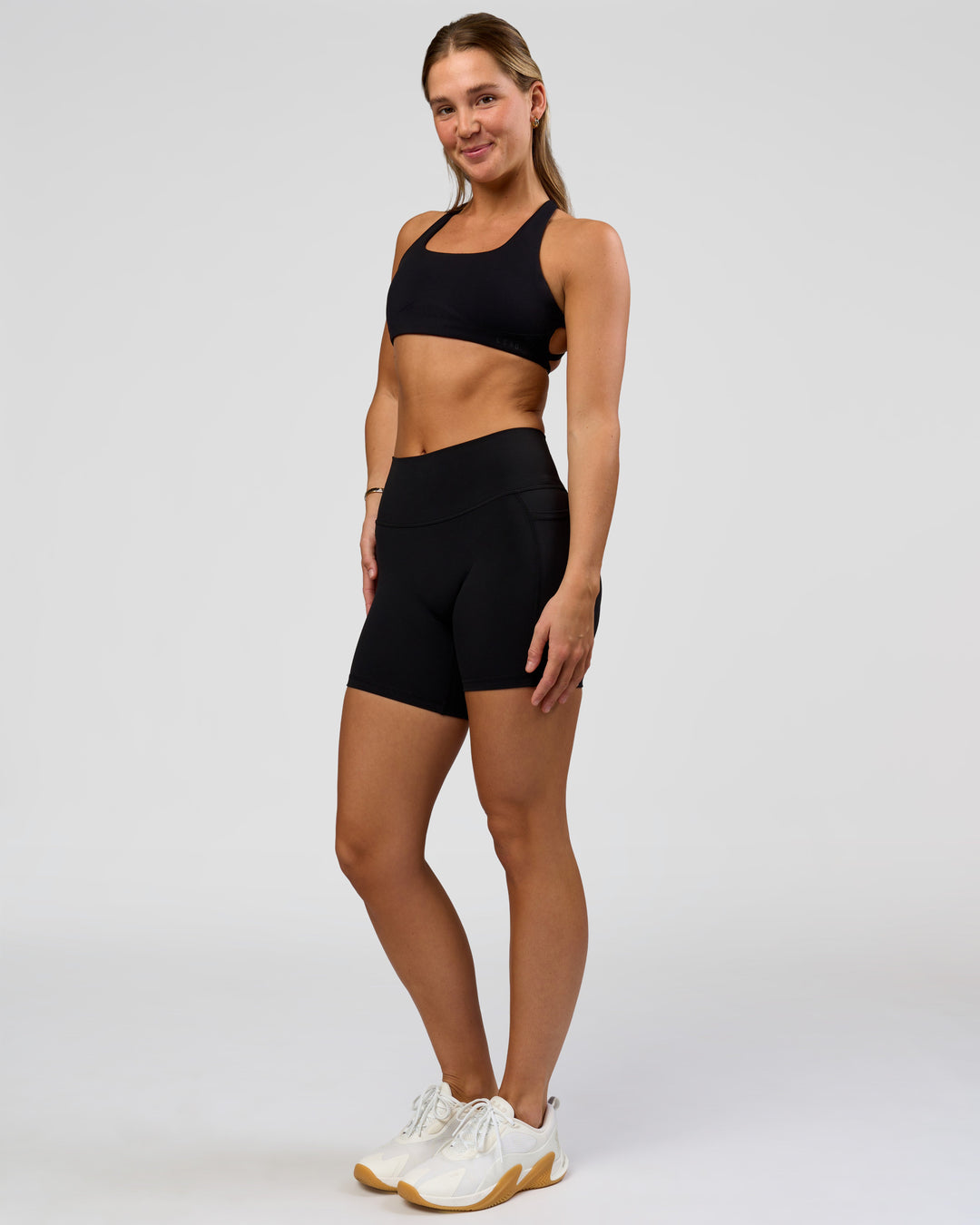 Woman wearing O.G. Fusion High-Rise 6" Short Pockets - Black | Model:Amity | Size:S - view 6