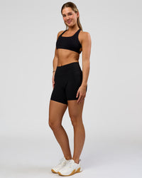 Woman wearing O.G. Fusion High-Rise 6" Short Pockets - Black | Model:Amity | Size:S | Thumbnail Index: 5