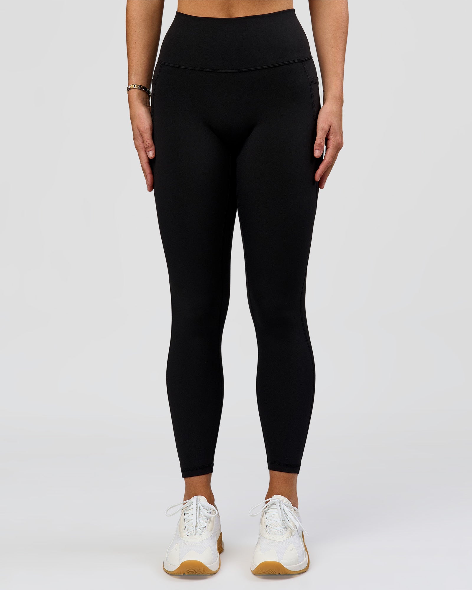 Woman wearing O.G. Fusion High-Rise Full Length Legging Pockets - Black | Model:Amity | Size:S