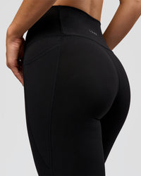 Woman wearing O.G. Fusion High-Rise Full Length Legging Pockets - Black | Model:Amity | Size:S | Thumbnail Index: 3