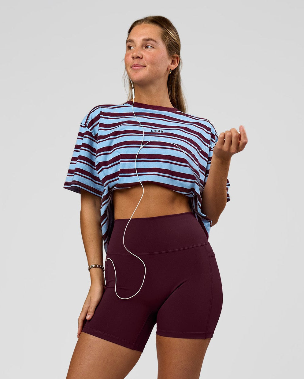Woman wearing O.G. Fusion Ultra High-Rise 6" Short Pockets - Cherry Lacquer | Model:Amity | Size:S - view 2