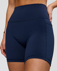 Woman wearing O.G. Fusion Ultra High-Rise 6" Short Pockets - Future Navy | Model:Amity | Size:S | Thumbnail Index: 1