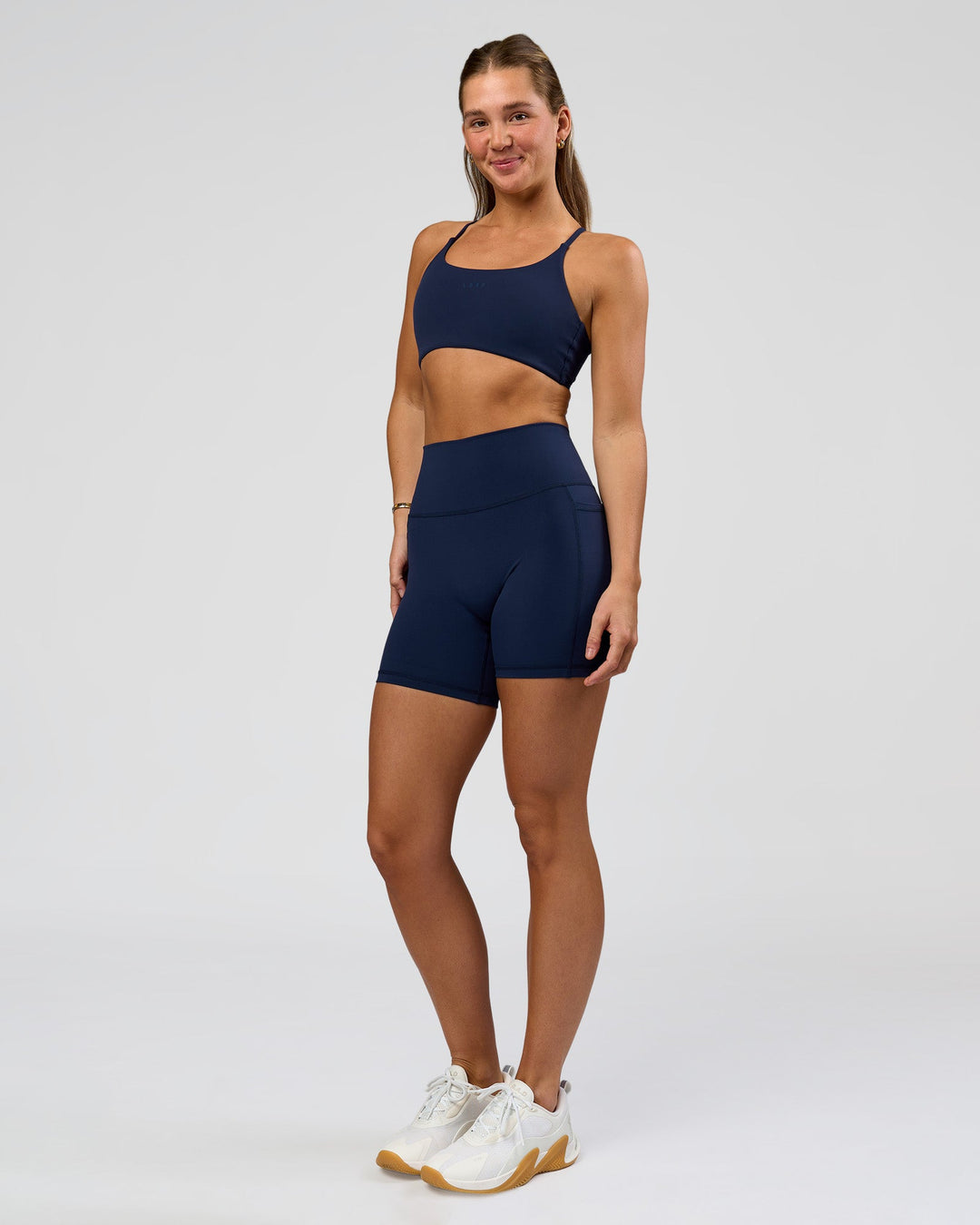 Woman wearing O.G. Fusion Ultra High-Rise 6" Short Pockets - Future Navy | Model:Amity | Size:S - view 3