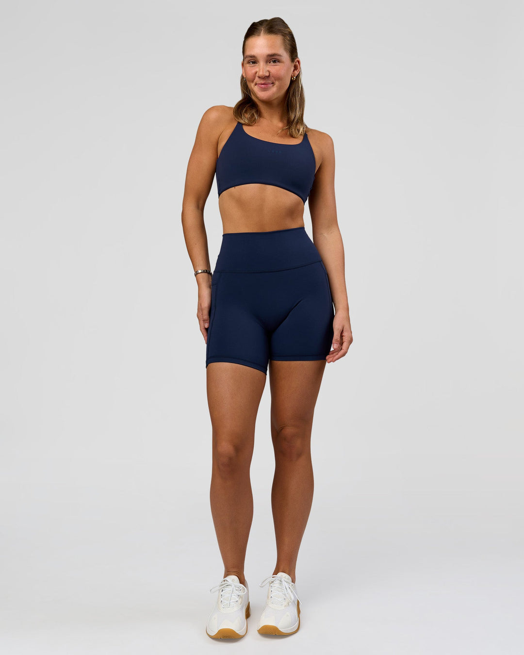Woman wearing O.G. Fusion Ultra High-Rise 6" Short Pockets - Future Navy | Model:Amity | Size:S - view 6