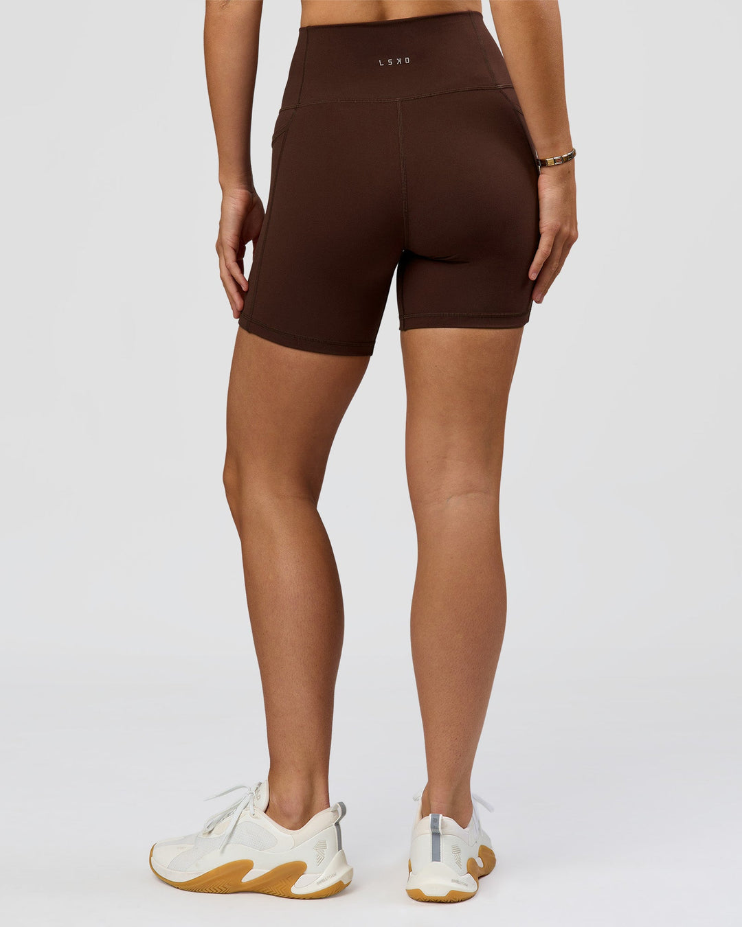 Woman wearing O.G. Fusion Ultra High-Rise 6" Short Pockets - Hot Chocolate | Model:Amity | Size:S - view 7