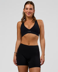Woman wearing RXD Mid-Rise 6" Short - Black | Model:Amity | Size:S | Thumbnail Index: 0
