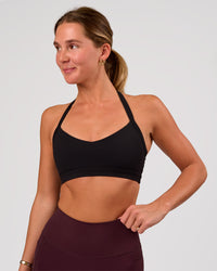 Woman wearing Unleash Sports Bra - Black | Model:Amity | Size:S | Thumbnail Index: 2