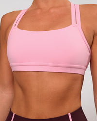 Woman wearing Velocity Sports Bra - Pink Rose | Model:Amity | Size:S | Thumbnail Index: 1