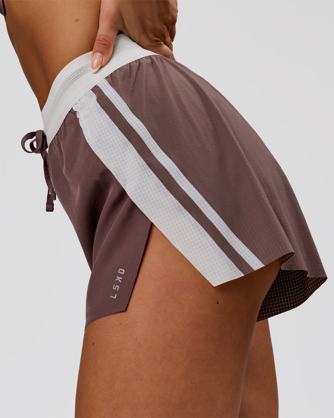 Woman wearing Accelerate 3" Force High-Rise Running Short - Cocoa Powder | Model:Bianca | Size:S - view 4