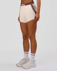 Woman wearing Accelerate 3" Force High-Rise Running Short - Cocoa Powder-Off White | Model:Bianca | Size:S | Thumbnail Index: 4