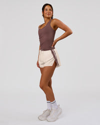 Woman wearing Accelerate 3" Force High-Rise Running Short - Cocoa Powder-Off White | Model:Bianca | Size:S | Thumbnail Index: 9