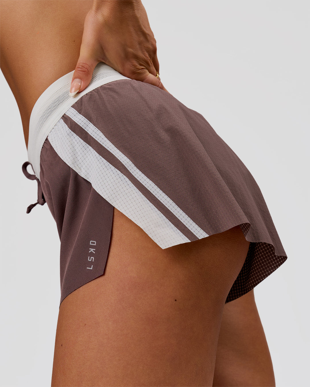 Woman wearing Accelerate 3" Force Mid-Rise Running Short - Cocoa Powder | Model:Bianca | Size:S - view 3
