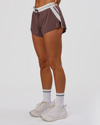 Woman wearing Accelerate 3" Force Mid-Rise Running Short - Cocoa Powder | Model:Bianca | Size:S | Thumbnail Index: 4