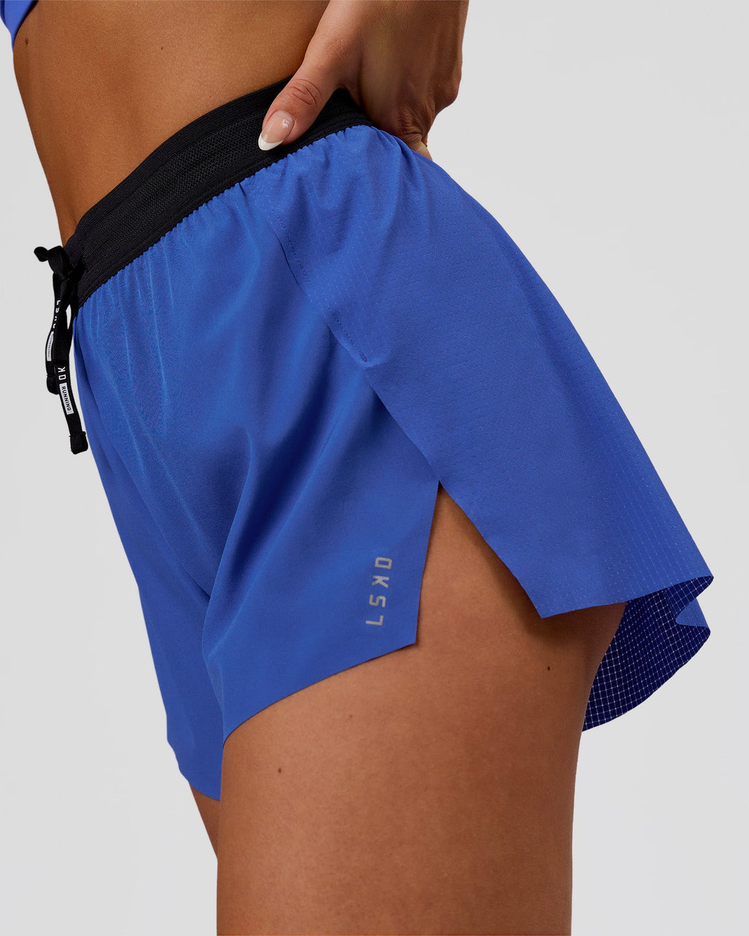 Woman wearing Accelerate 3" High-Rise Running Short - Black-Power Cobalt | Model:Bianca | Size:S - view 2
