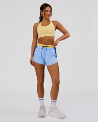 Woman wearing Accelerate 3" High-Rise Running Short - Power Cobalt-Open Air-Lemon | Model:Bianca | Size:S | Thumbnail Index: 3