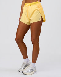 Woman wearing Accelerate 3" High-Rise Running Short - Sunbeam-Lemon | Model:Bianca | Size:S | Thumbnail Index: 9