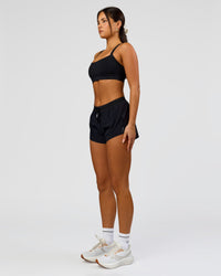 Woman wearing Accelerate 3" Mid-Rise Running Short - Black | Model:Bianca | Size:S | Thumbnail Index: 3
