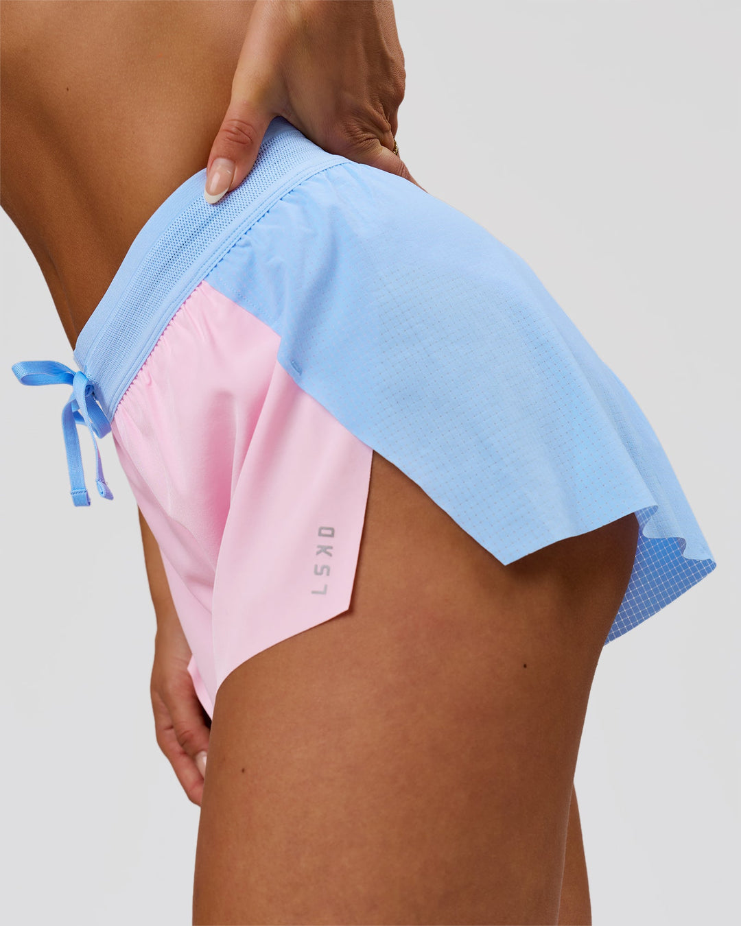 Woman wearing Accelerate 3" Mid-Rise Running Short - Open Air-Marshmallow | Model:Bianca | Size:S - view 6