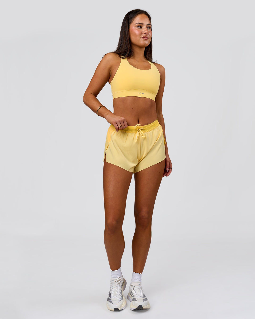 Woman wearing Accelerate 3" Mid-Rise Running Short - Sunbeam-Lemon | Model:Bianca | Size:S - view 4