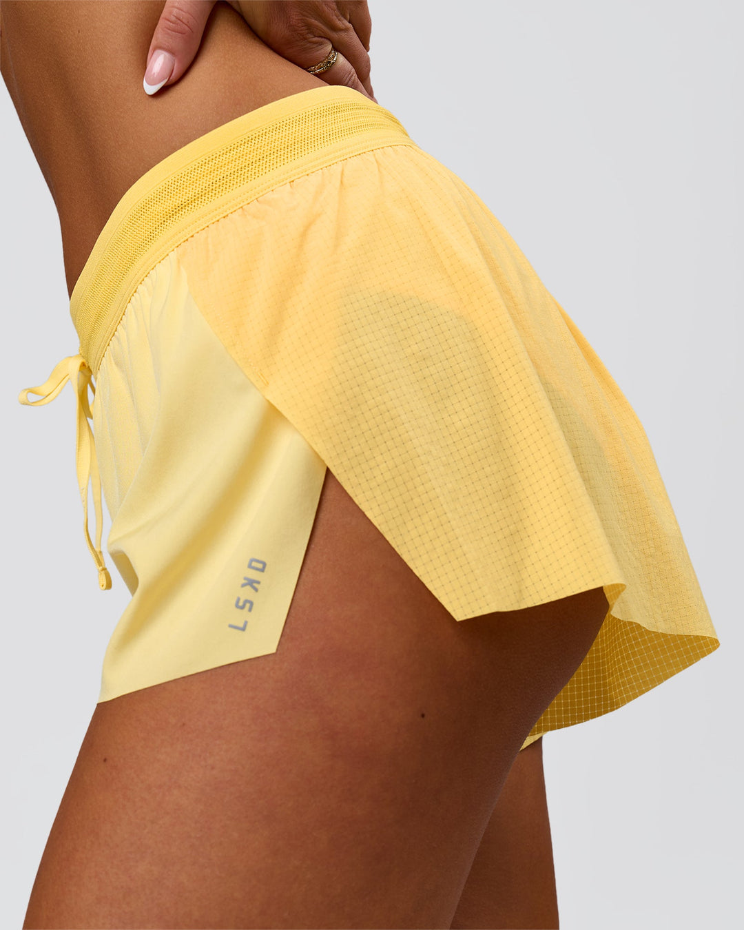 Woman wearing Accelerate 3" Mid-Rise Running Short - Sunbeam-Lemon | Model:Bianca | Size:S - view 7